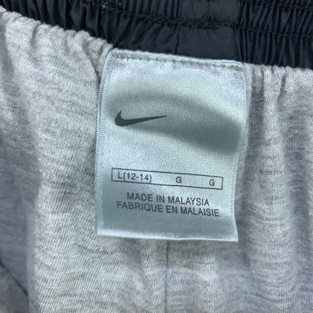 Nike Kids L 12-14 Black Nylon Windbreaker Track Pants Lined Zipper Cuffs Joggers